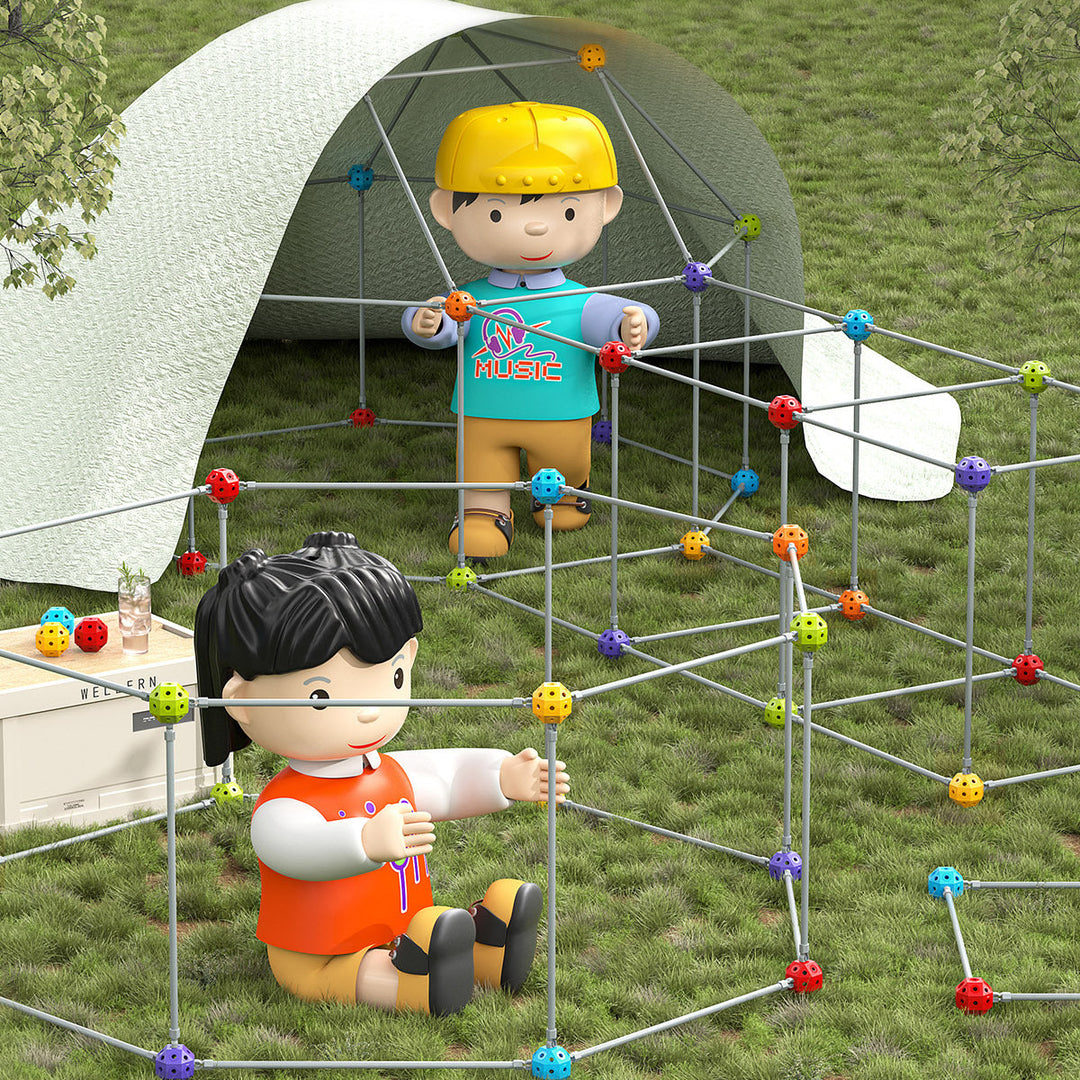 Children playing outdoors in constructed fort made from colorful bead and rod building blocks on grass