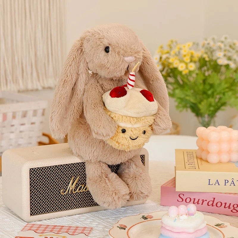 Soft plush bunny holding a little birthday cupcake, a sweet cuddly gift for birthdays and Easter celebrations
