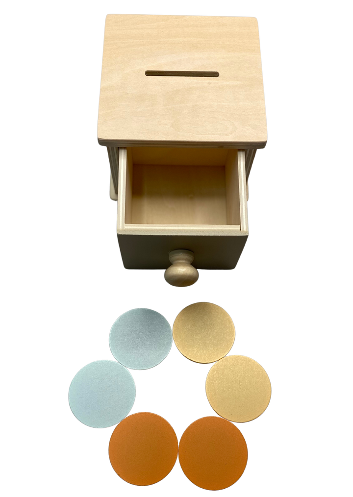 Montessori object permanence box with coin slot and wooden drawer to teach babies cause and effect